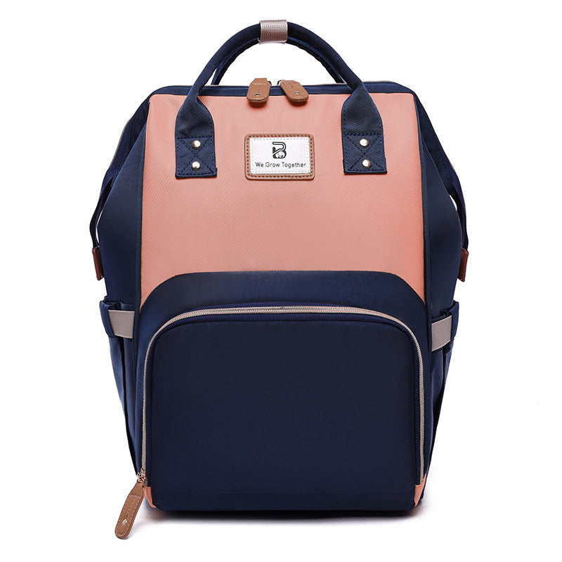 Sac à langer bleu saumon avec lit pliable et poches isothermes